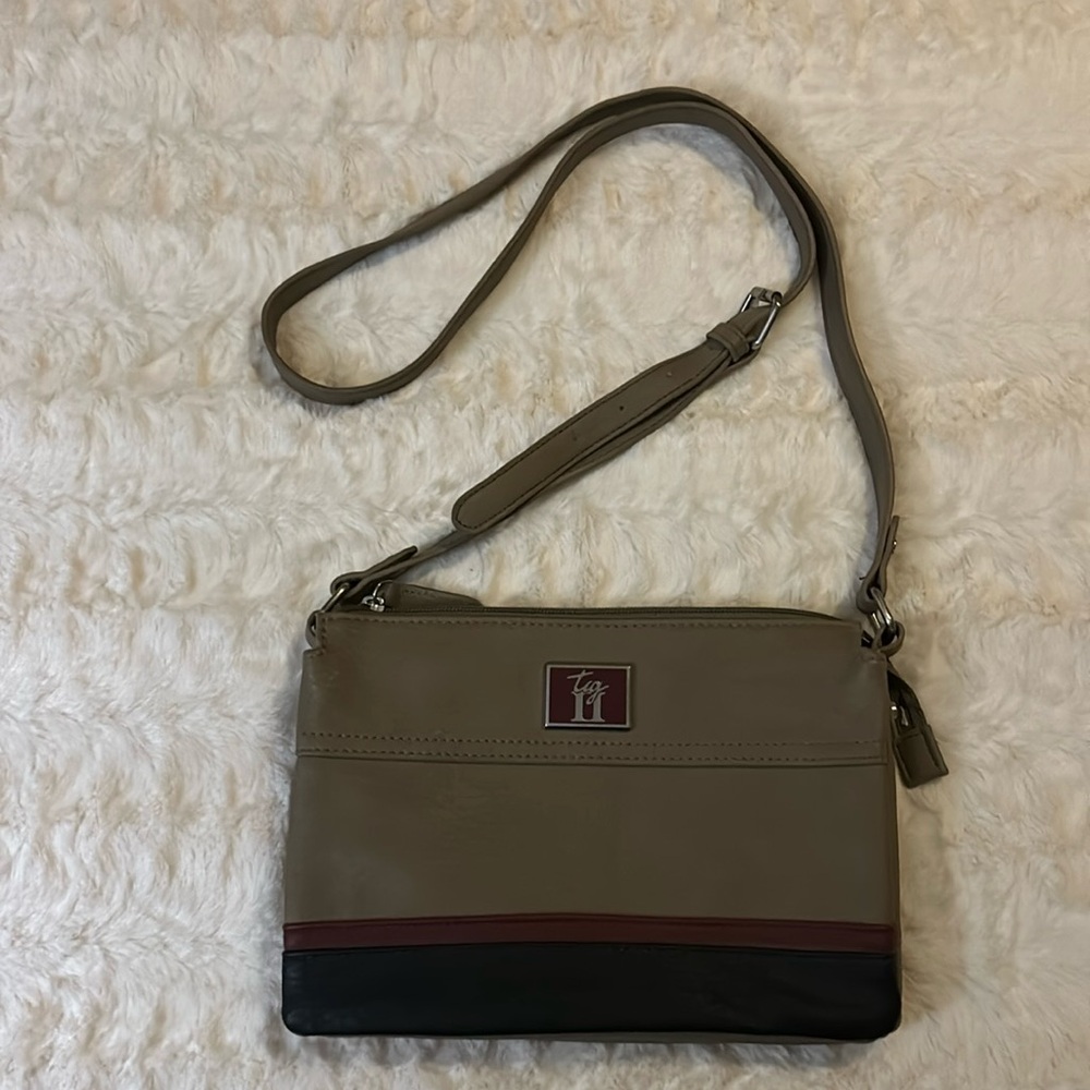 New small to medium purse without tags. Taupe, with maroon and black stripe.